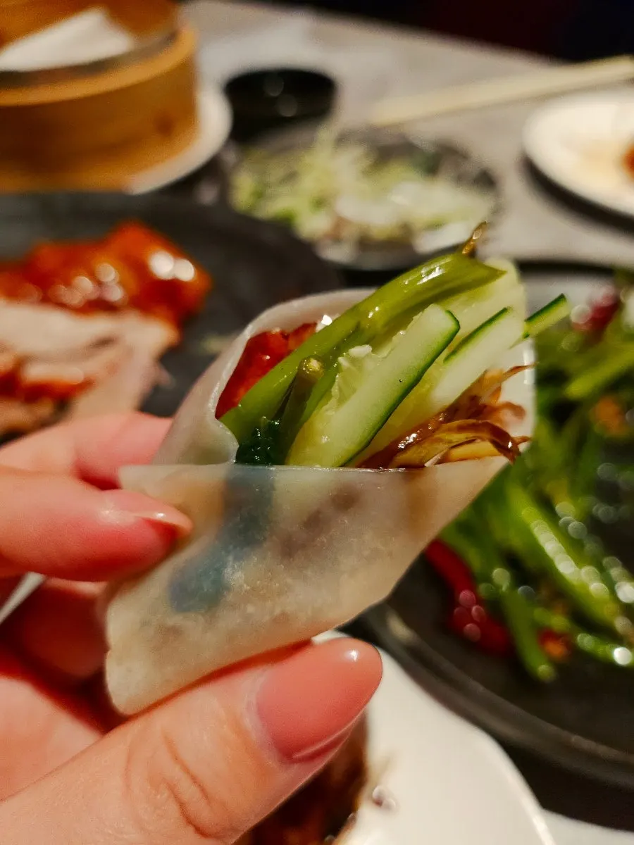 Peking duck with yajang sauce, scallion strips and cucumber strips