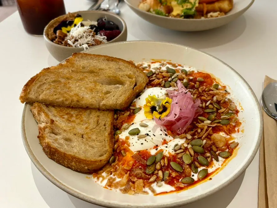 Chili garlic butter, yogurt, and poached egg dish