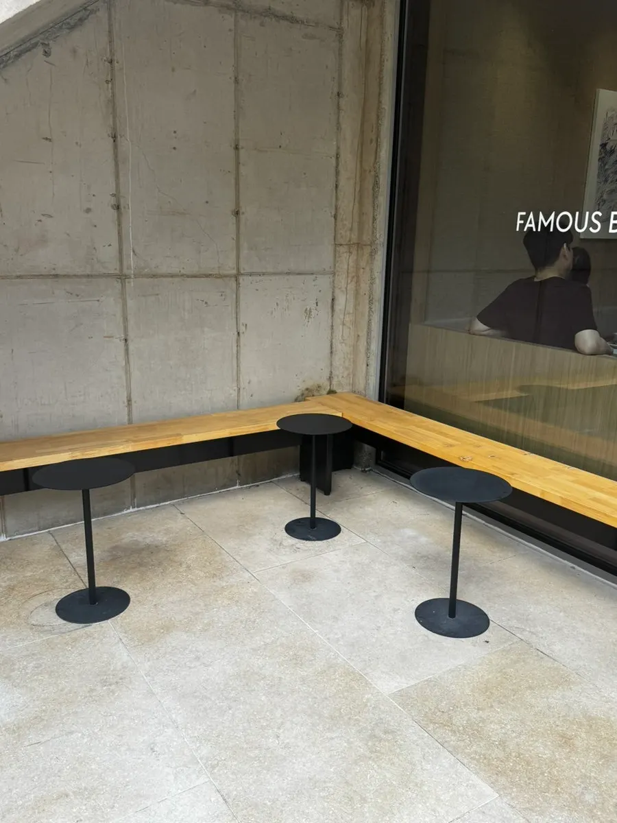 First-floor counter and two-person tables at Famous Benny