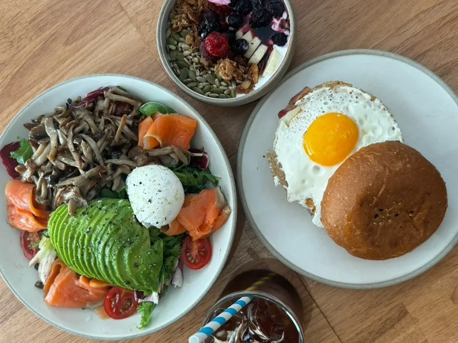 House salad and bacon egg roll brunch spread