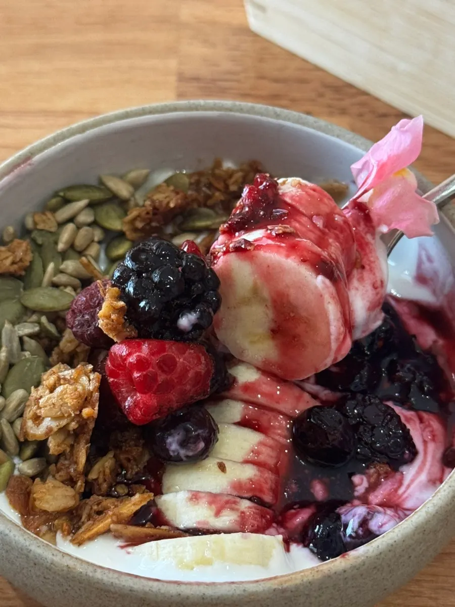 Yogurt bowl topped with berries and banana