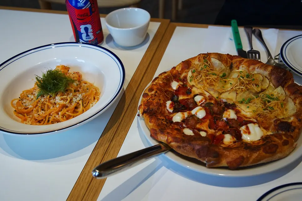 Classic Combo spread with half-and-half pizza and pasta