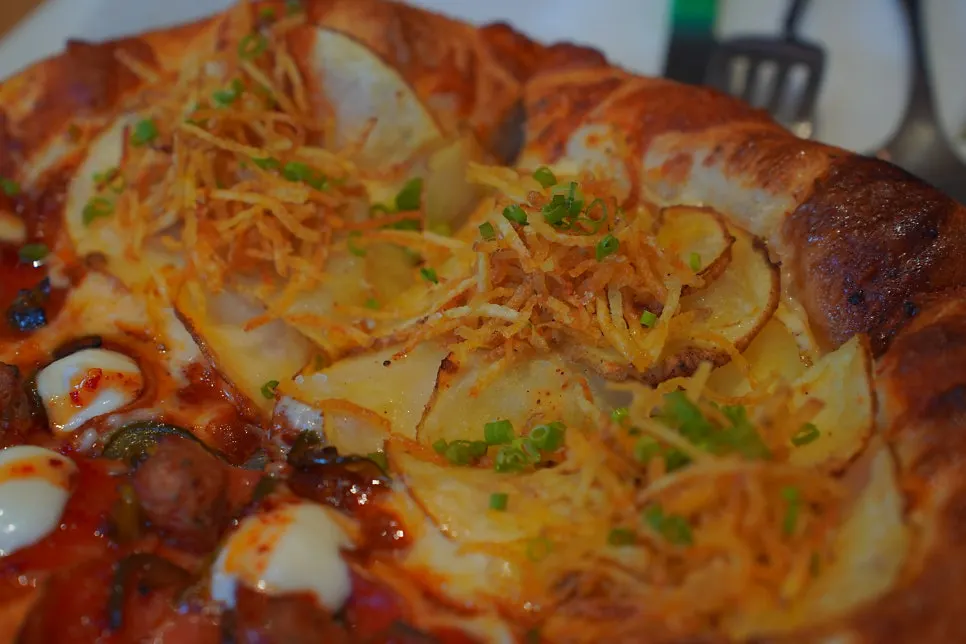 Potato pizza piled with crispy fries