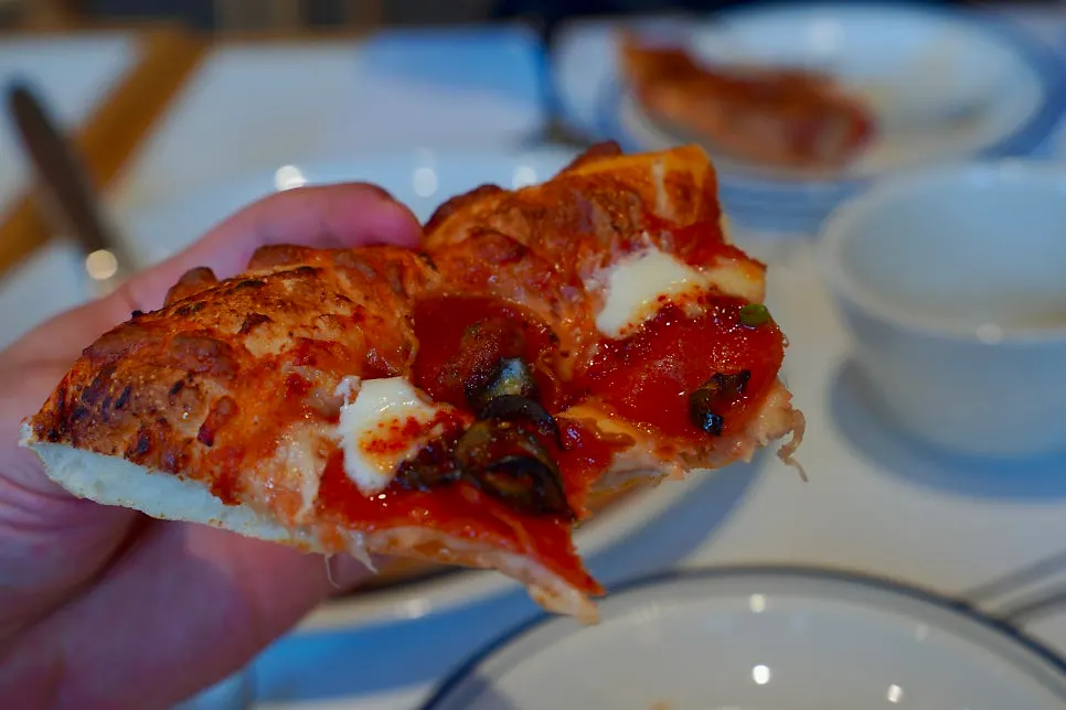 A slice of Hot Honey Pepperoni pizza