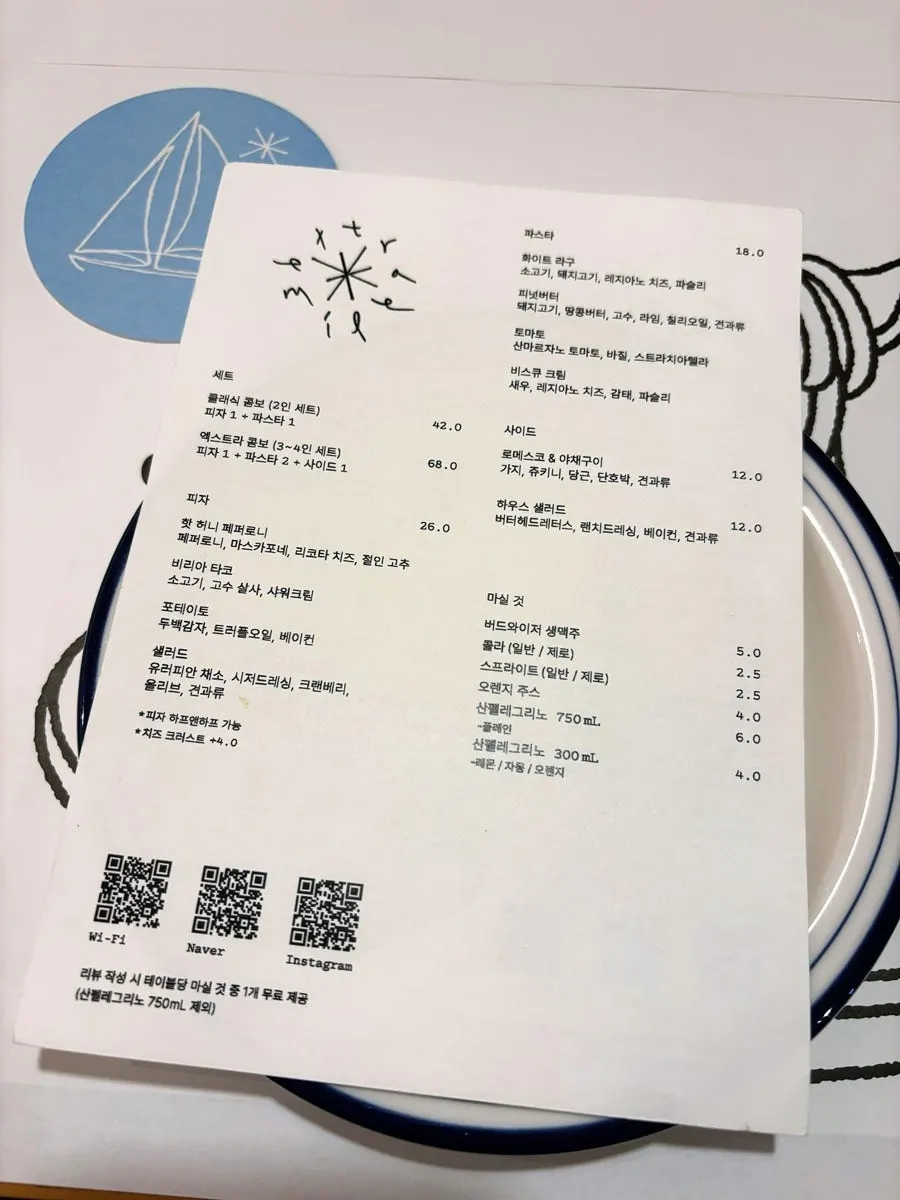 Extra Mile's pizza and pasta menu board