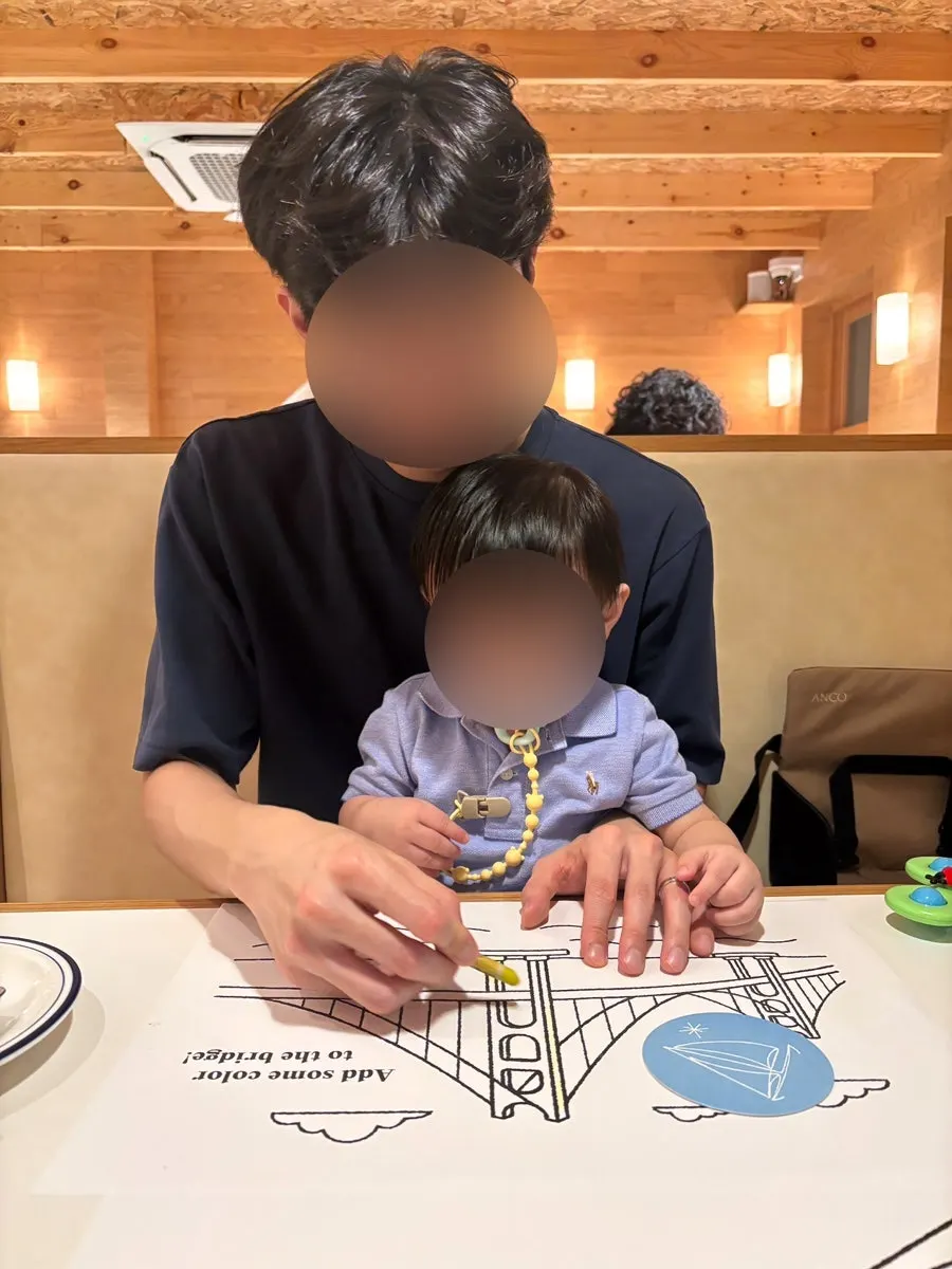 Colored pencils and a coloring placemat on the table
