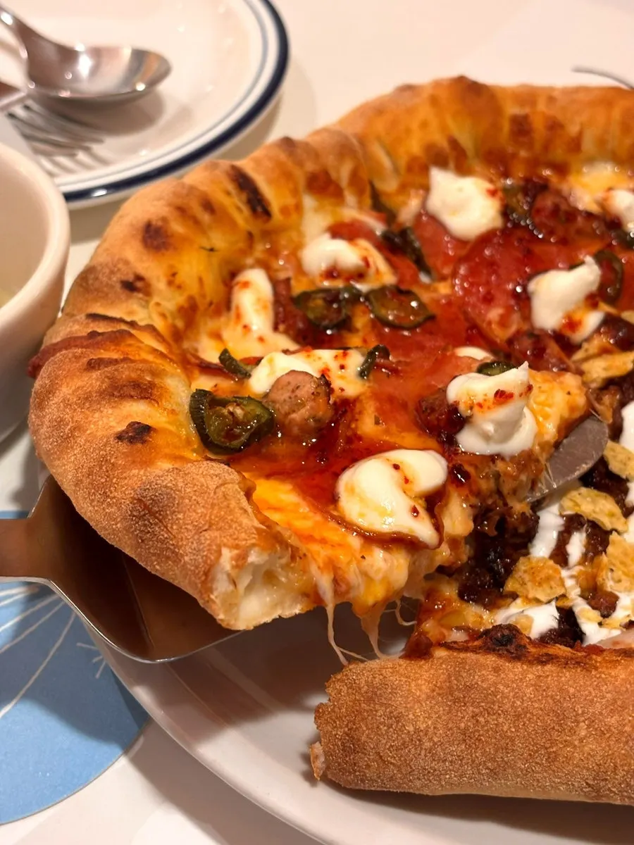Whole pizza showing the cheese crust edge