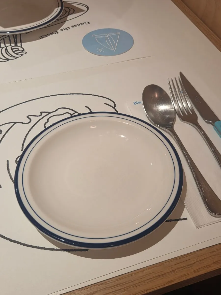 Table at Extra Mile with half-and-half pizza info