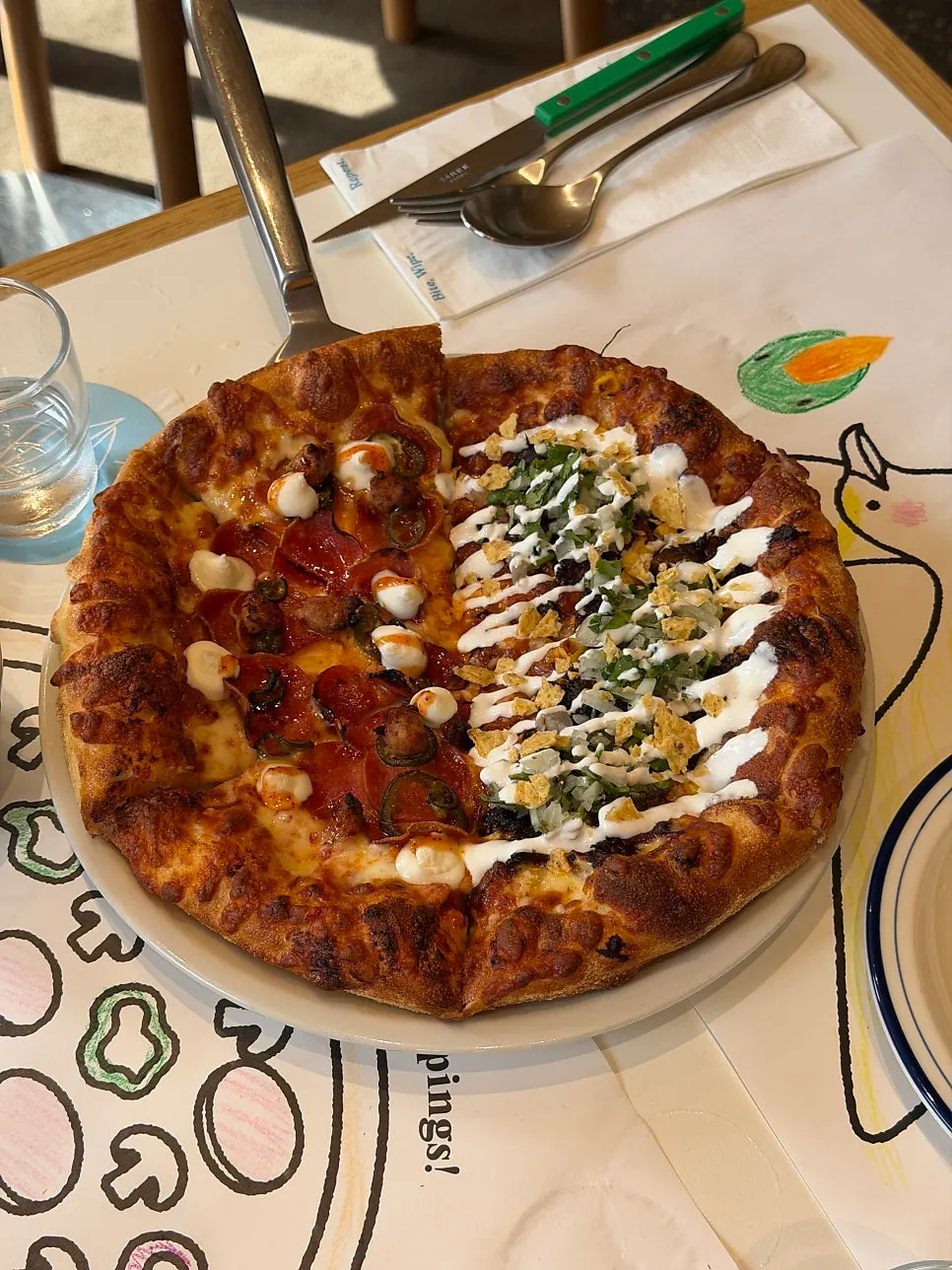 Half-and-half pizza with hot honey pepperoni and birria taco