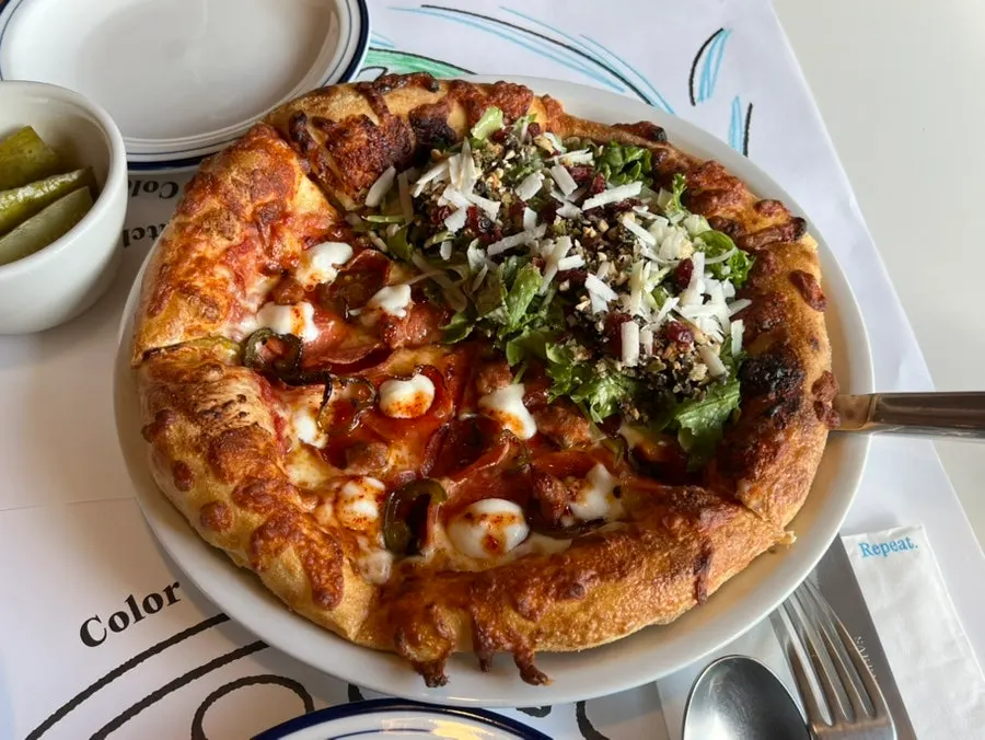 Half-and-half hot honey pepperoni and salad pizza