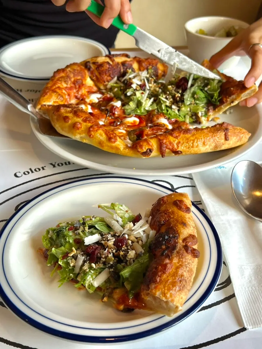 A full half-and-half pizza from Extra Mile
