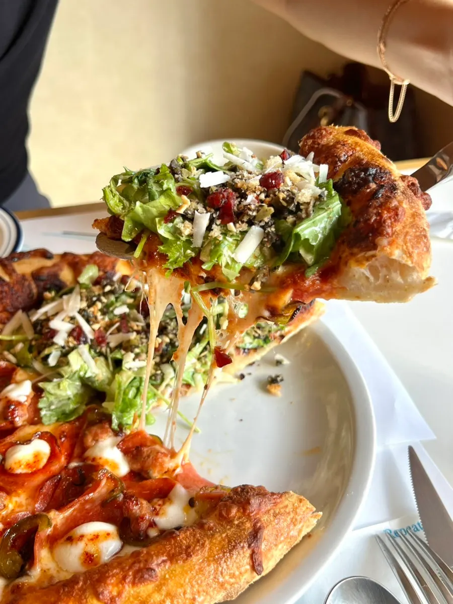 Pizza and pasta laid out together on the table