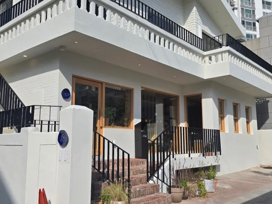 Extra Mile's exterior tucked in a Gwangalli alley