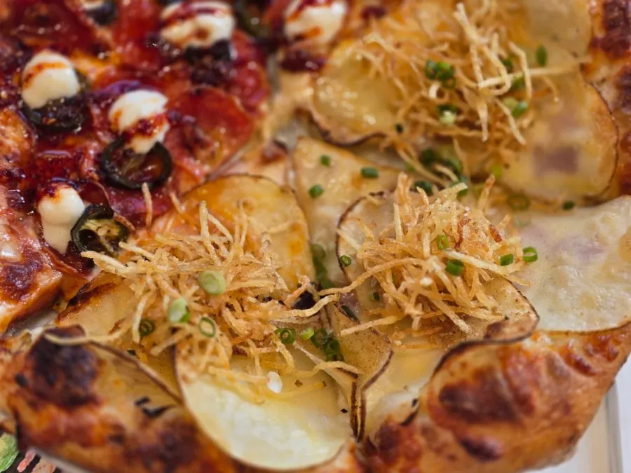 A slice of the hot honey pepperoni pizza