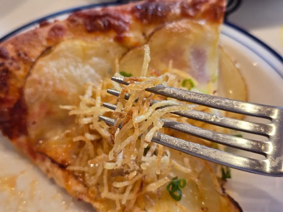Cross-section showing the pizza's chewy dough