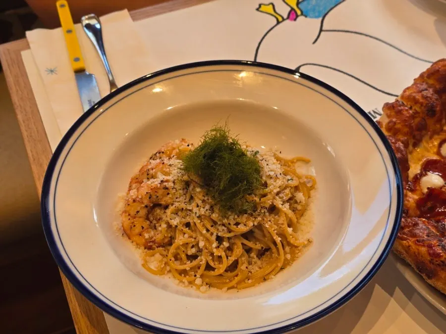 Pasta dish served alongside the pizza