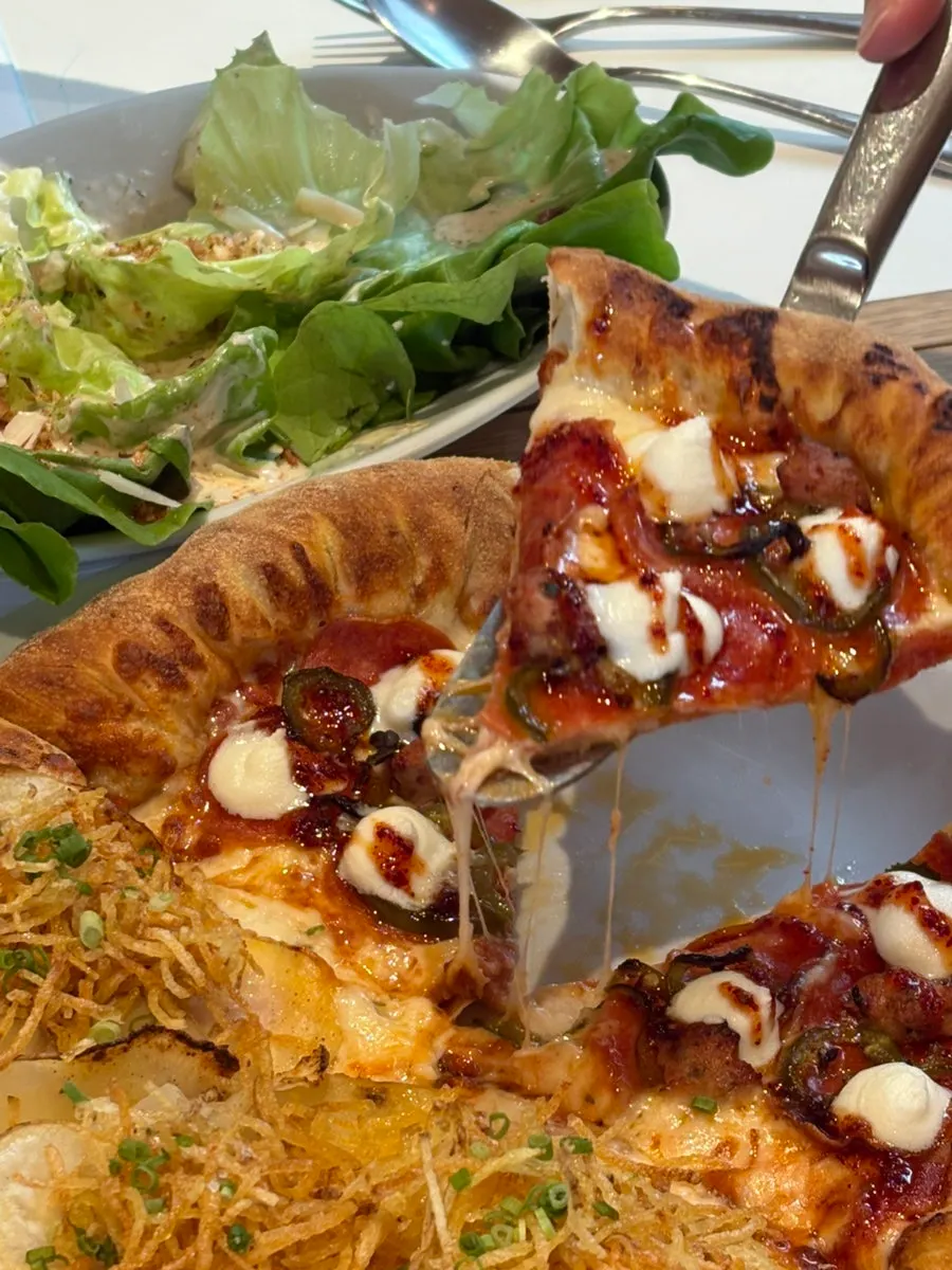 An empty half-and-half pizza plate, fully finished