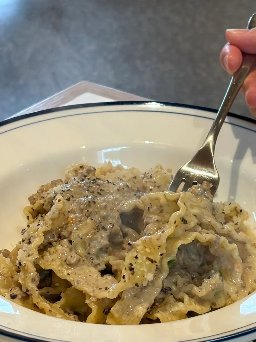 White ragu pasta noodles with plenty of meat in the sauce