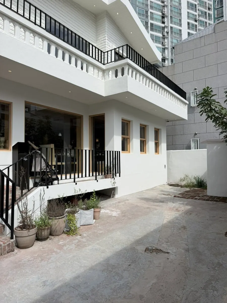 Exterior of Extra Mile's building with a European-house feel