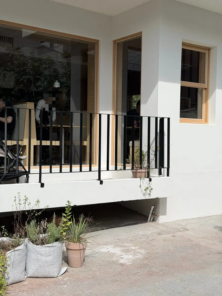 Extra Mile's space blending white tones and brick