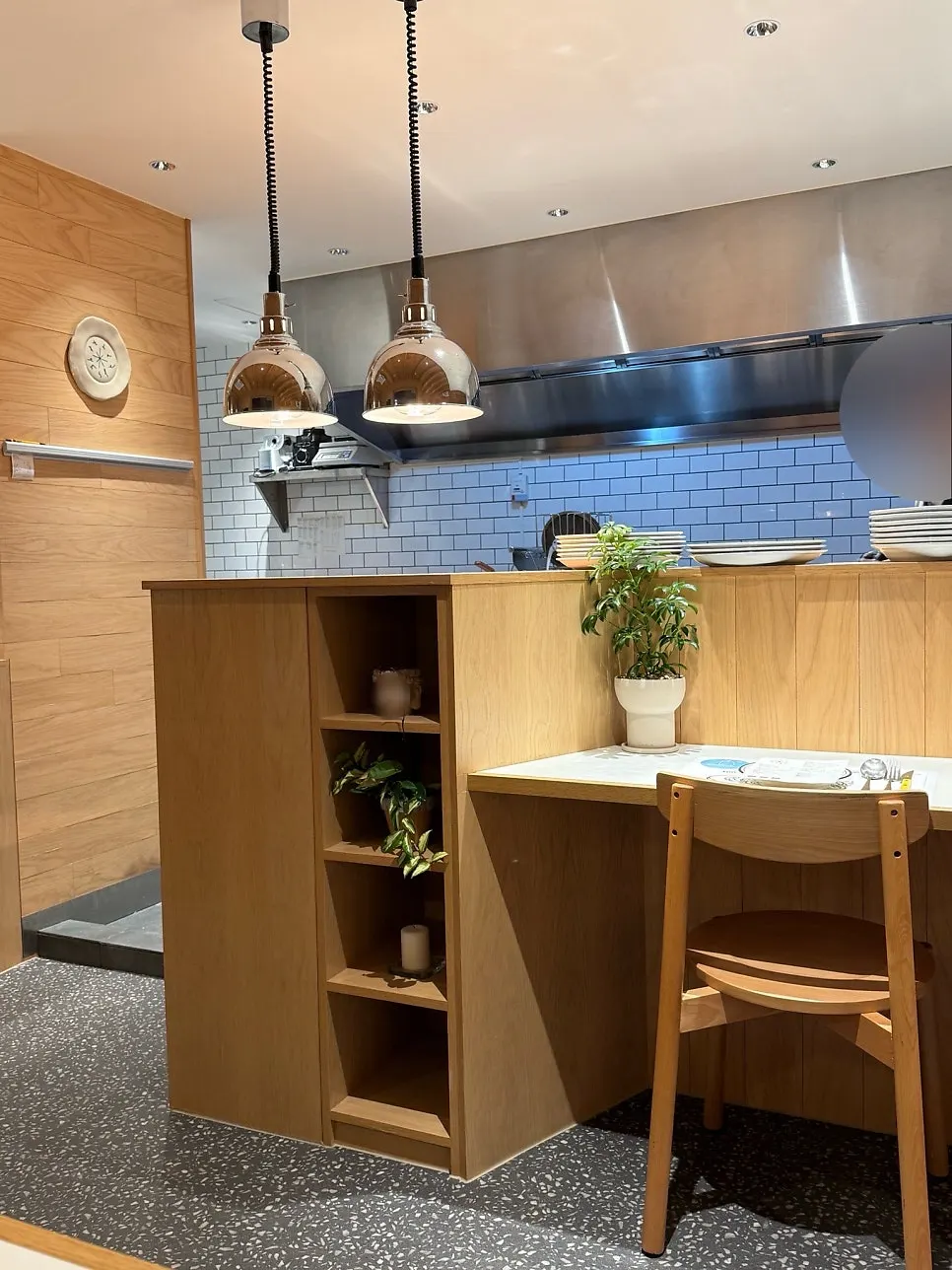 Extra Mile's interior decorated in wood and white