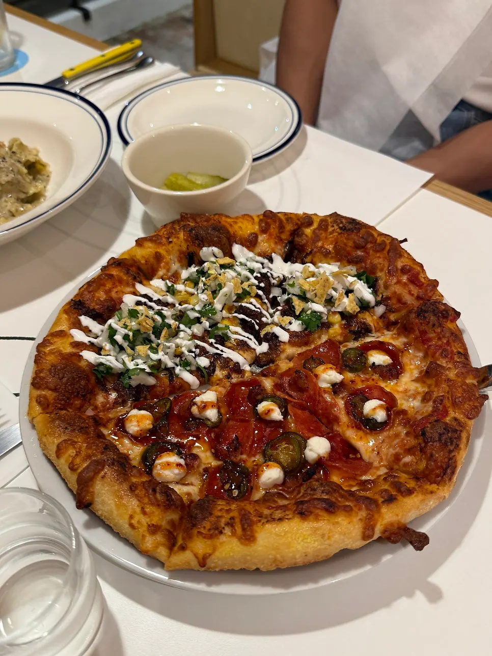 A freshly baked half-and-half pizza