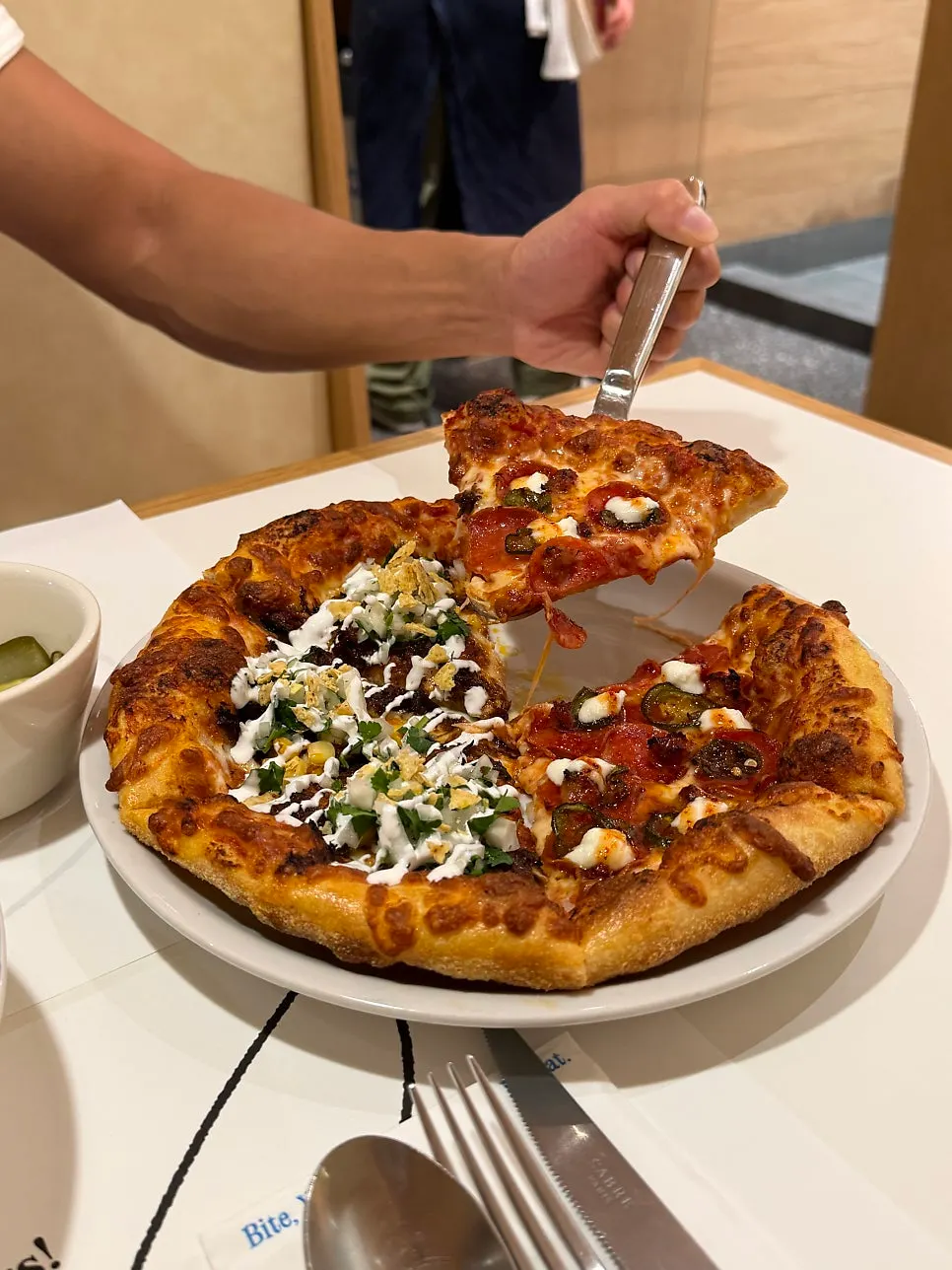 A slice of hot honey pepperoni pizza