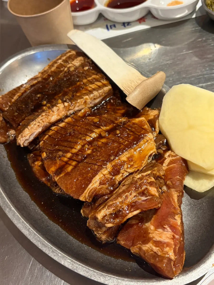 Plate of raw grade 1 chilled pork marinated ribs
