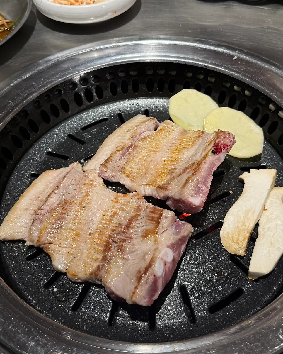 Two servings of raw ribs with bone attached