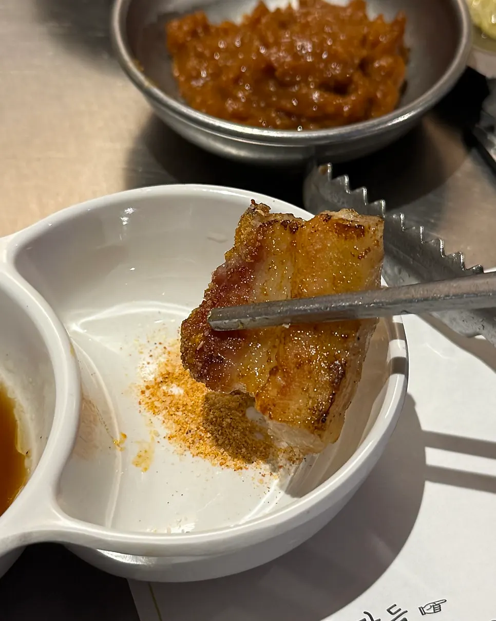 A piece of raw rib dipped in barley shrimp salt