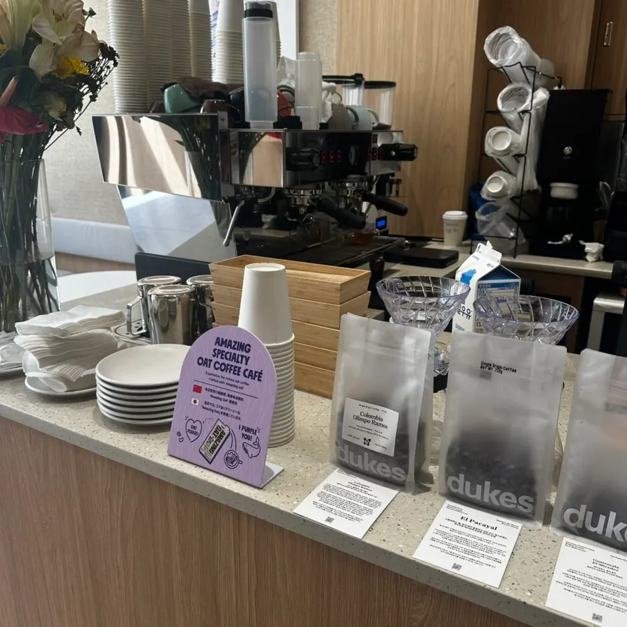 Menu board listing coffee and matcha drinks