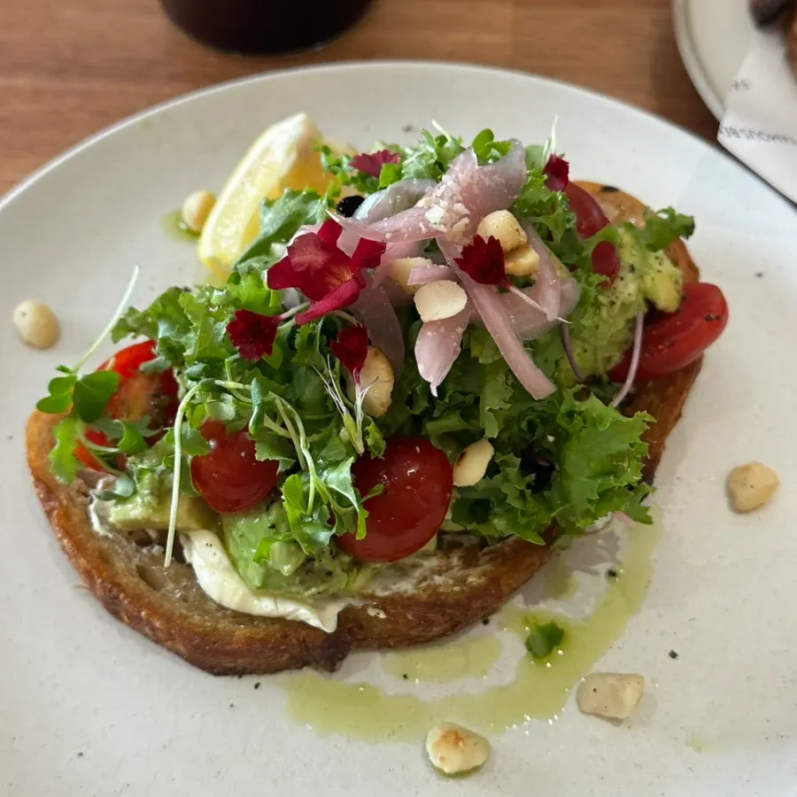Close-up of avocado toast with avocado piled high