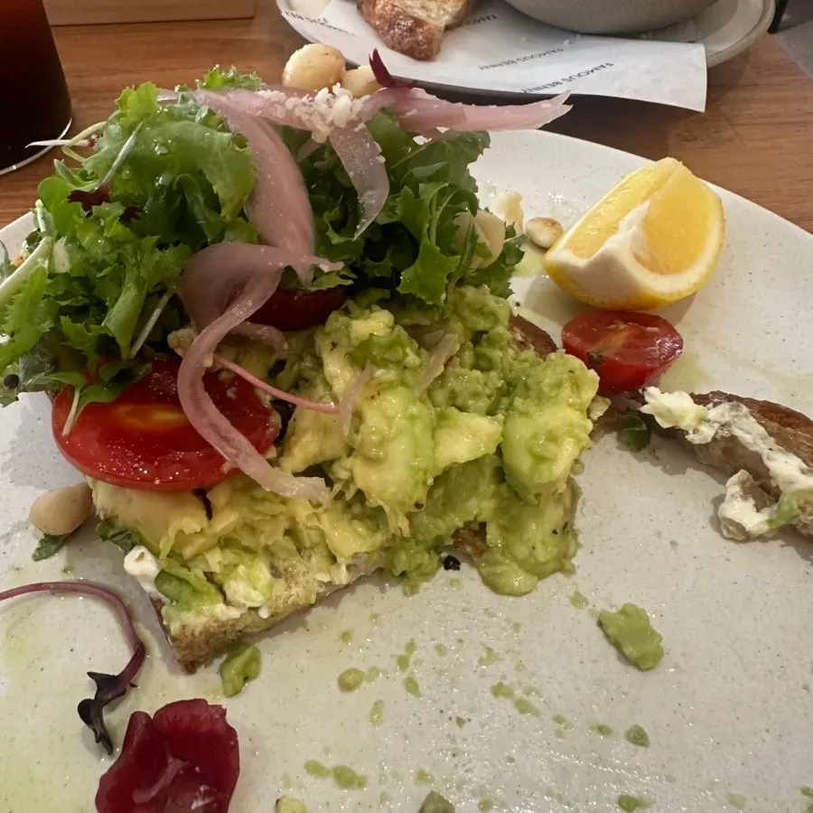 Cross-section of avocado toast topped with extras
