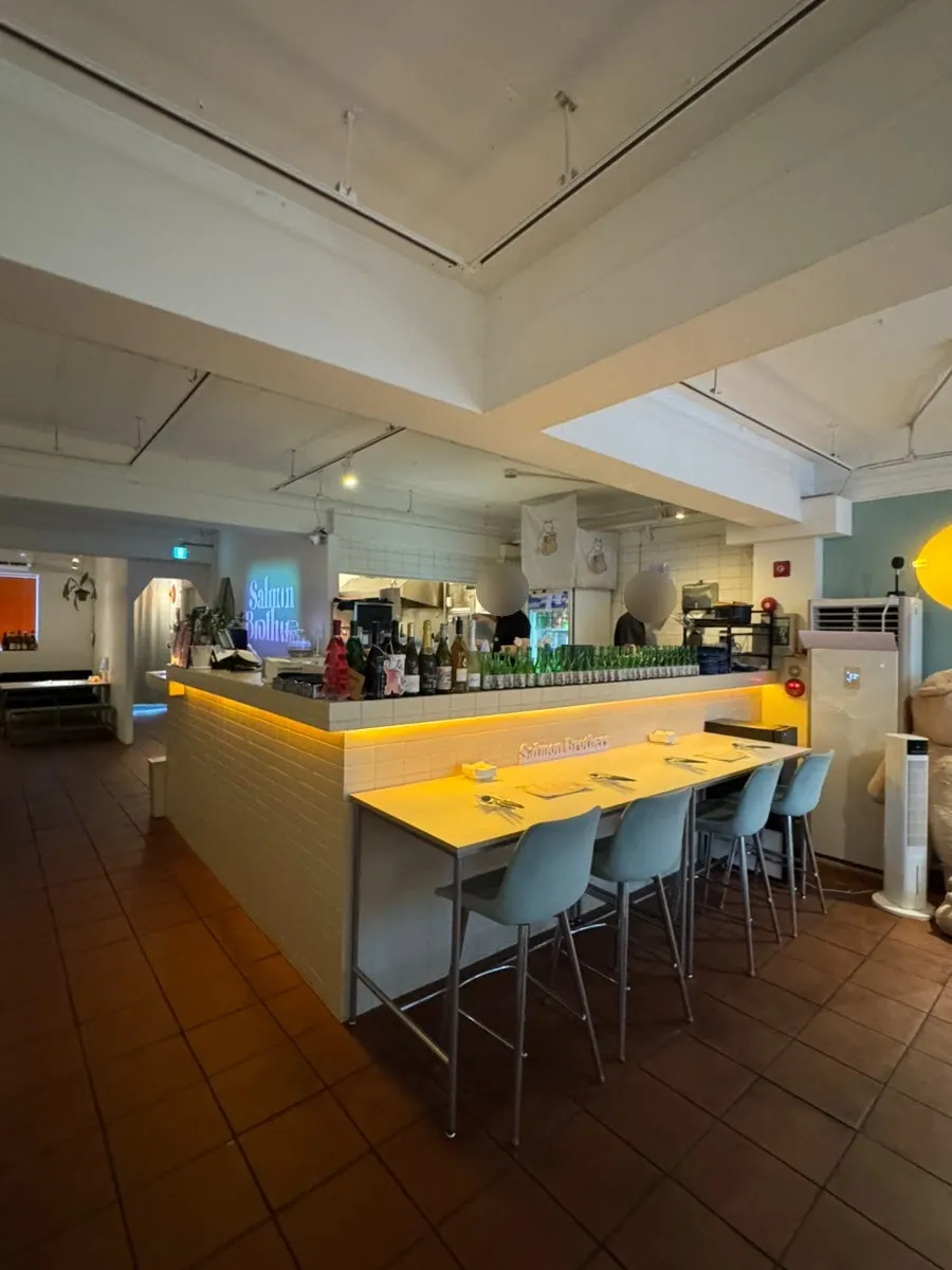Salmon Brothers interior decorated in orange tones and plants
