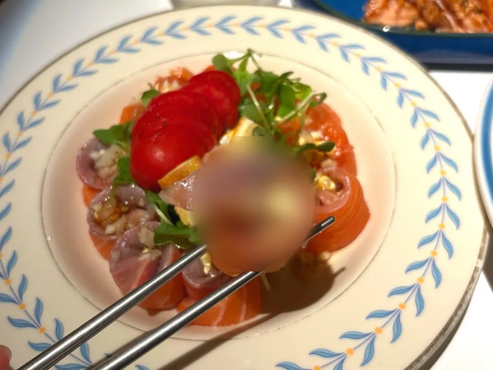 Salmon cream cheese roll served with cherry tomatoes