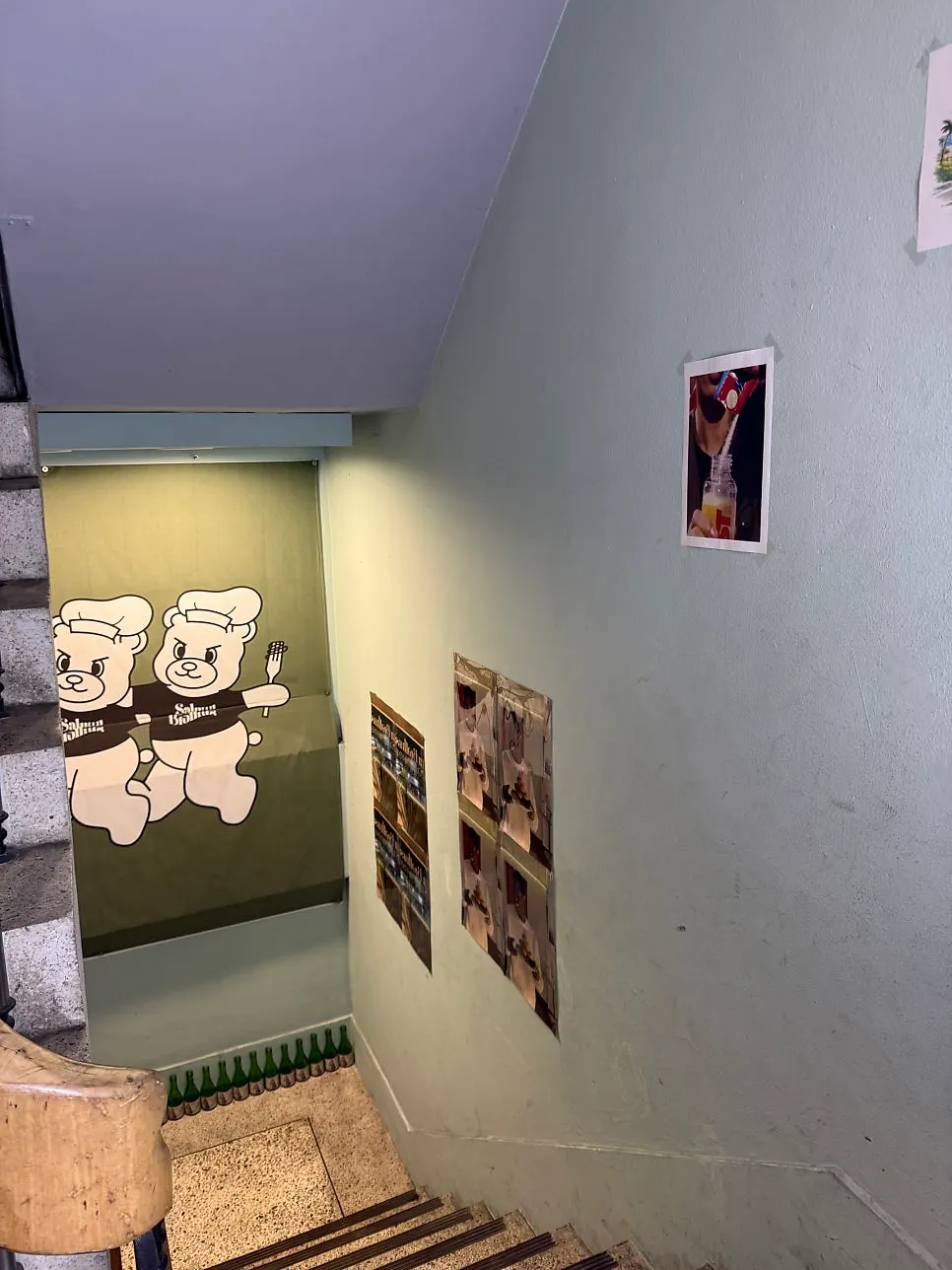 Restaurant stairway with character posters