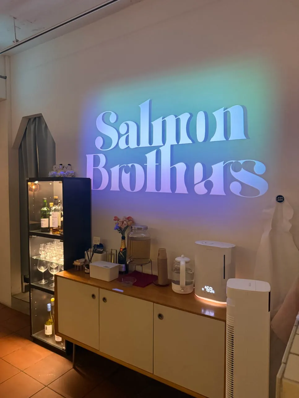 Restaurant logo wall lit with soft lighting