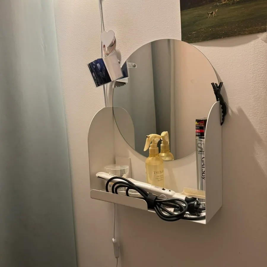 Mouthwash and a hair straightener in the bathroom
