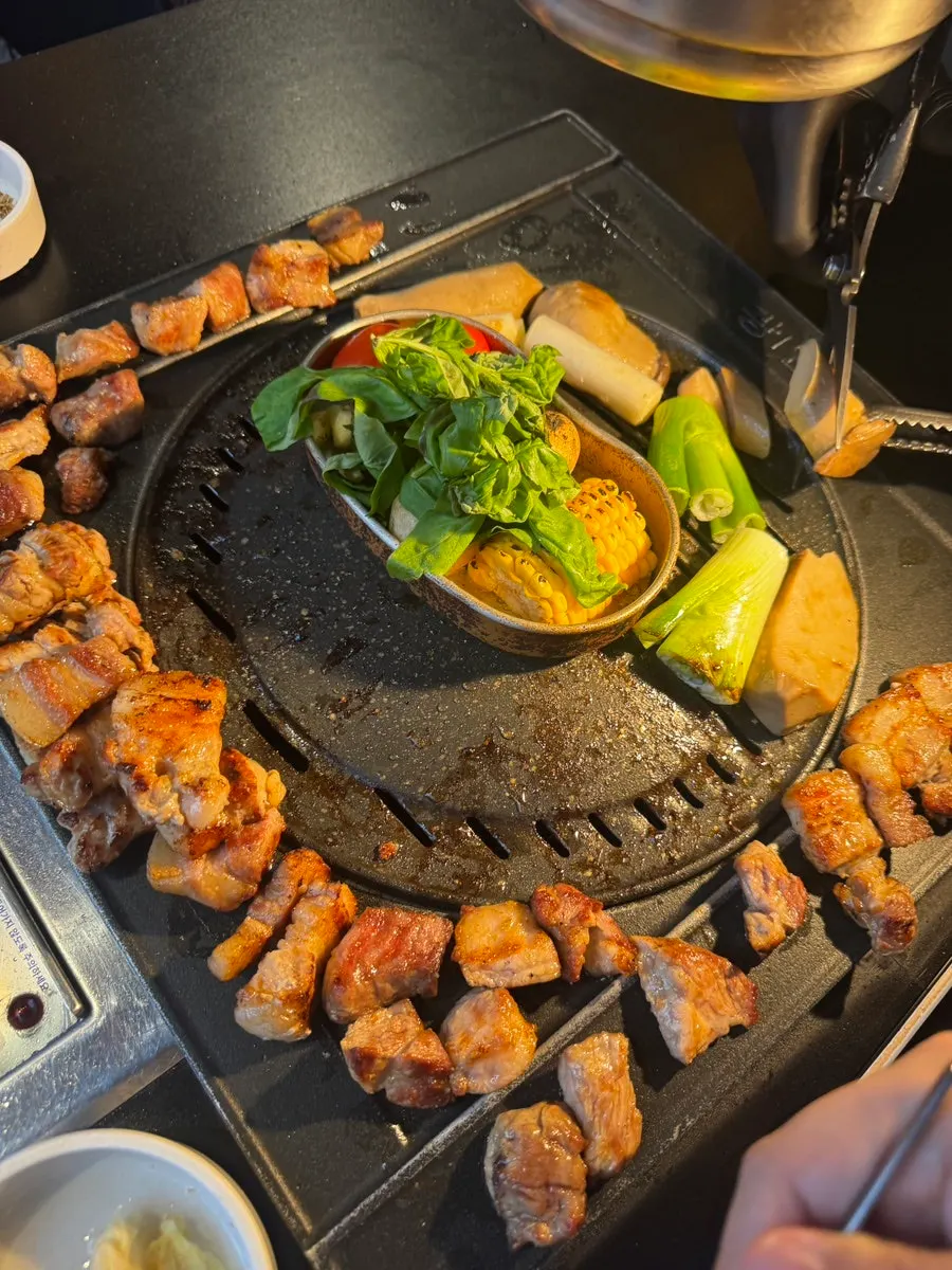 Pork belly and pork shoulder grilling on the pan