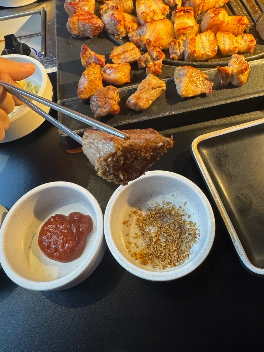 Tomato, corn, and potato placed on the grill