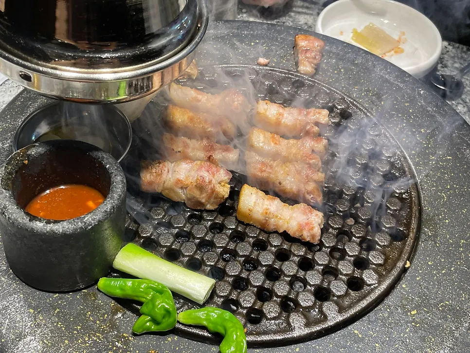 Grilled pork belly cooked by staff