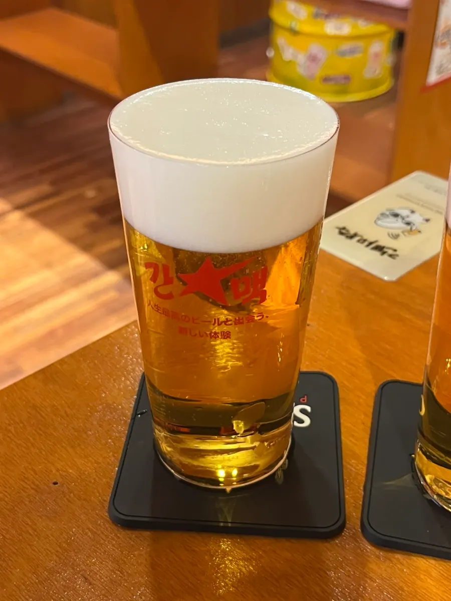 Sapporo draft beer poured into a thin glass