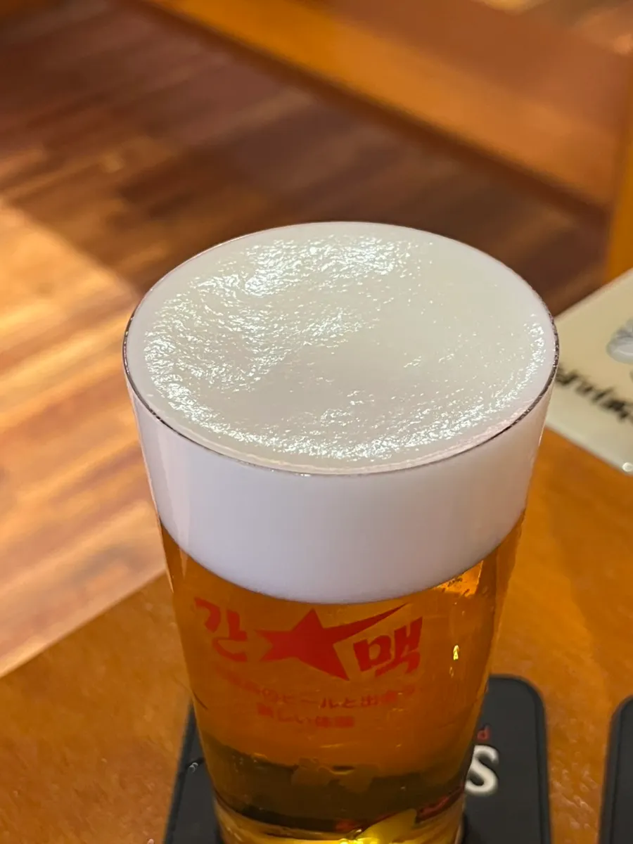 Sapporo draft beer with dense foam
