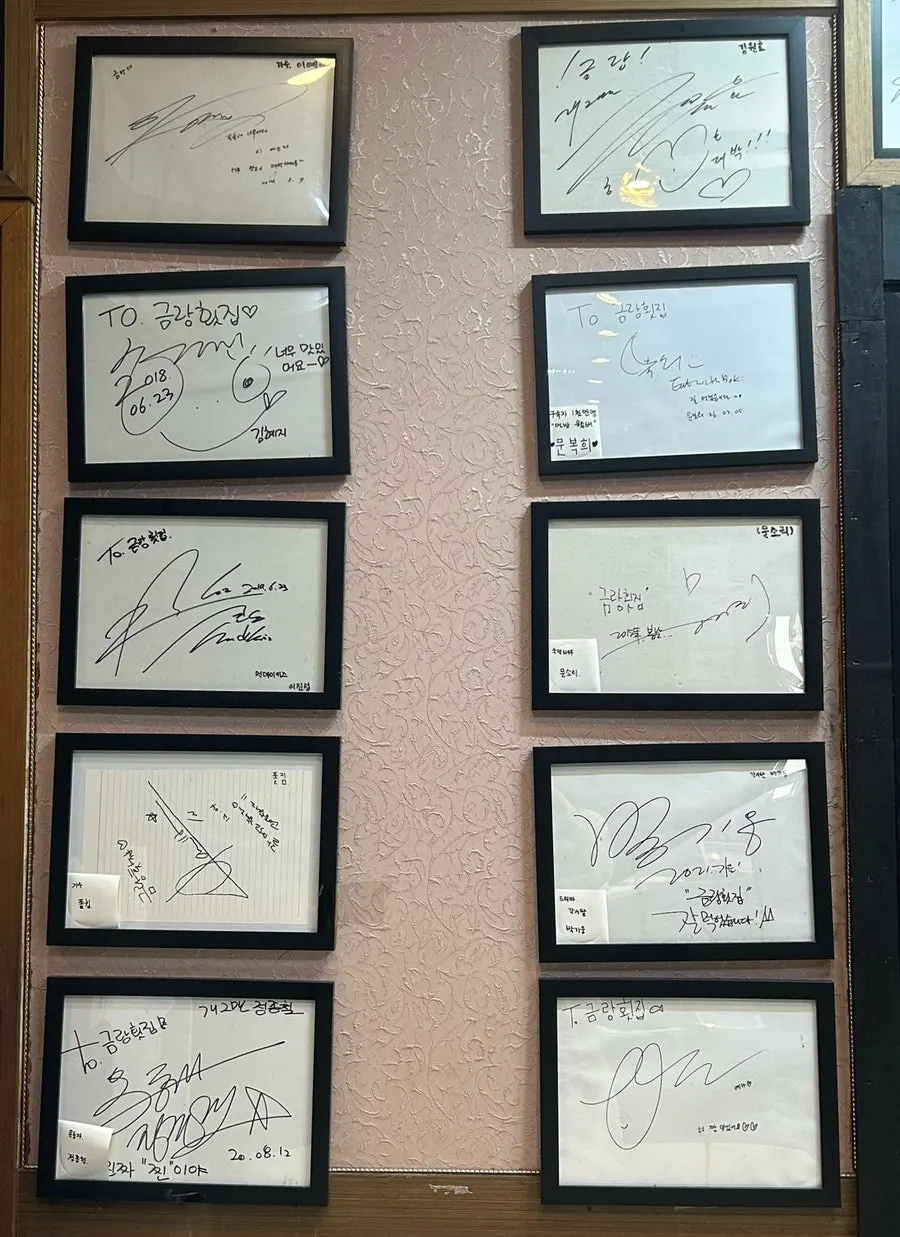 Visitor signatures and a Blue Ribbon covering the wall