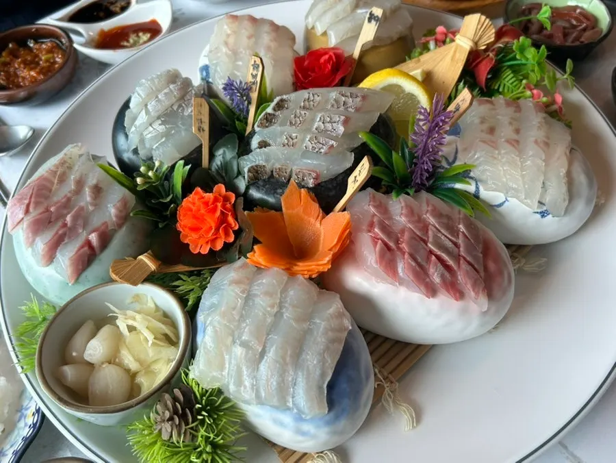 A table full of dishes before the sashimi arrives
