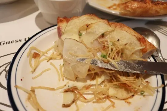 Cross-section of the thin, chewy pizza dough