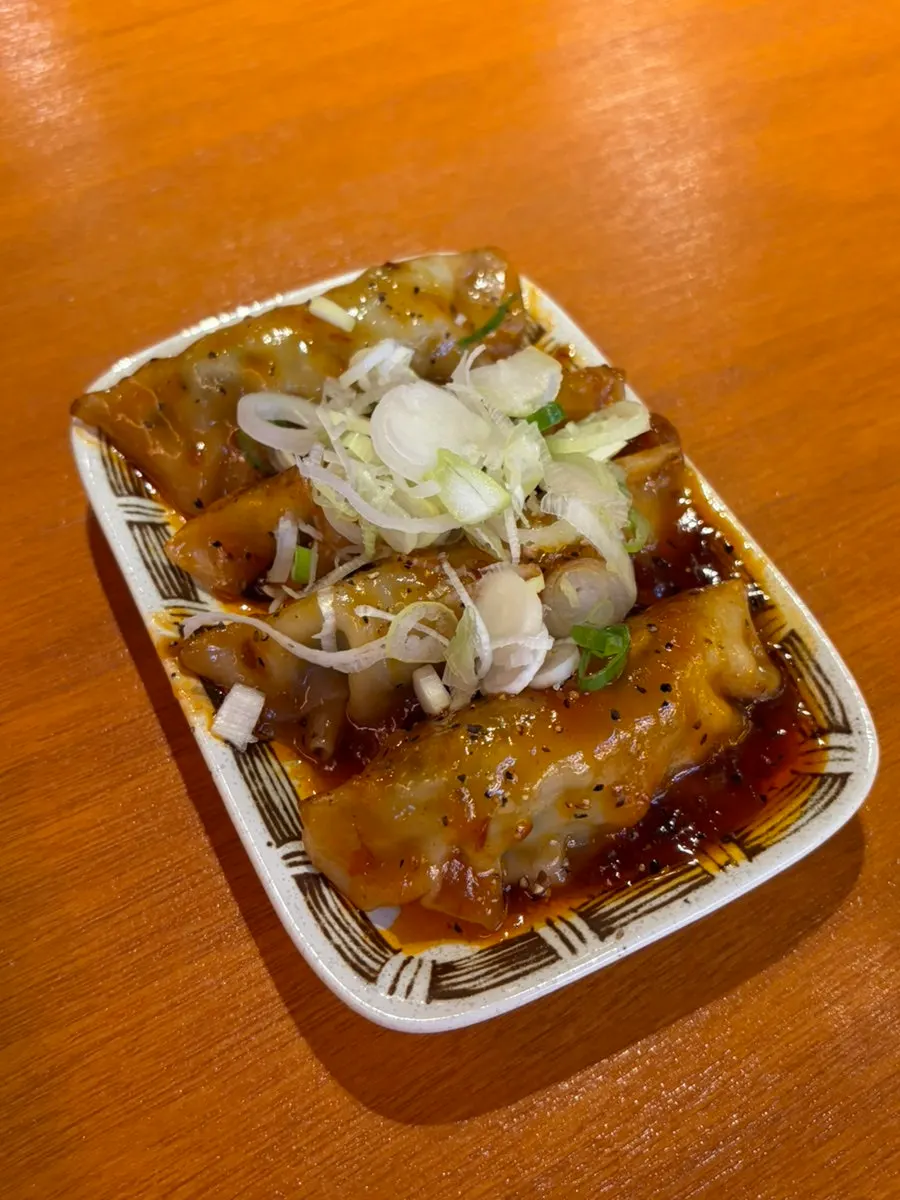 Extra dumplings ordered with seasoned fried chicken sauce
