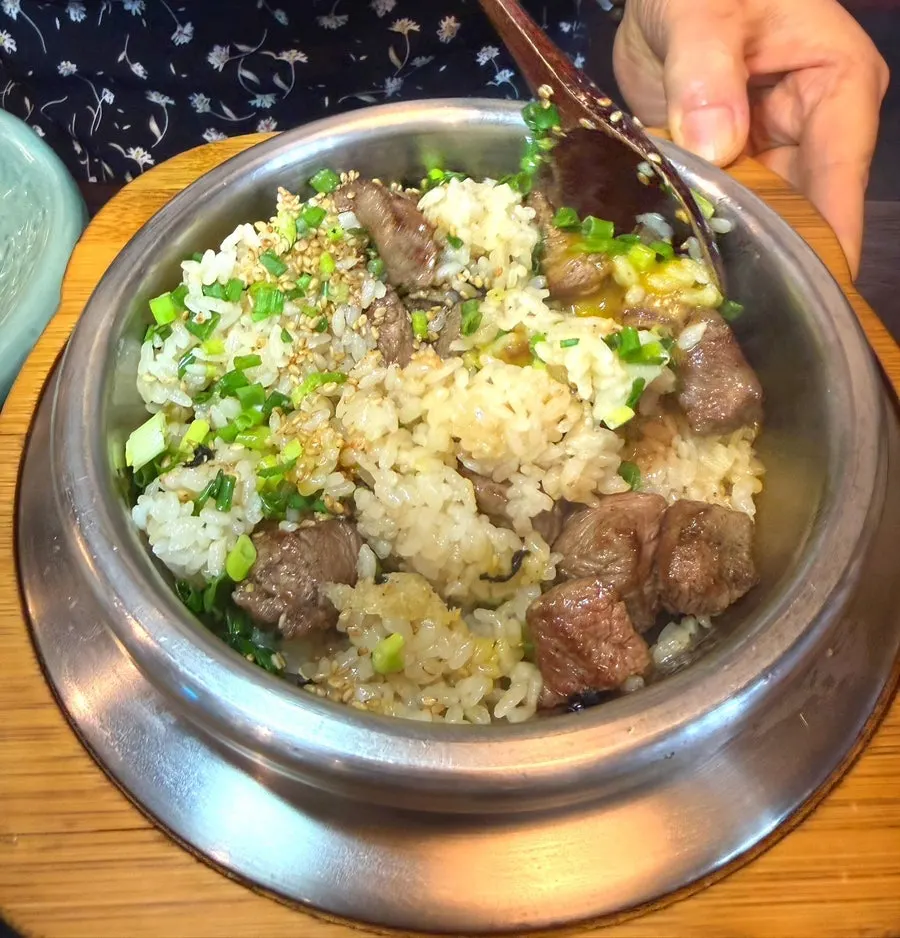 Pot rice with large pieces of steak