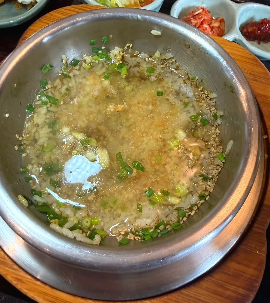 Scorched rice in the pot prepared with broth