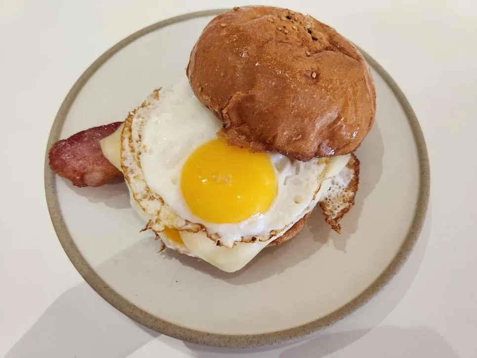 A well-shaped bacon egg roll
